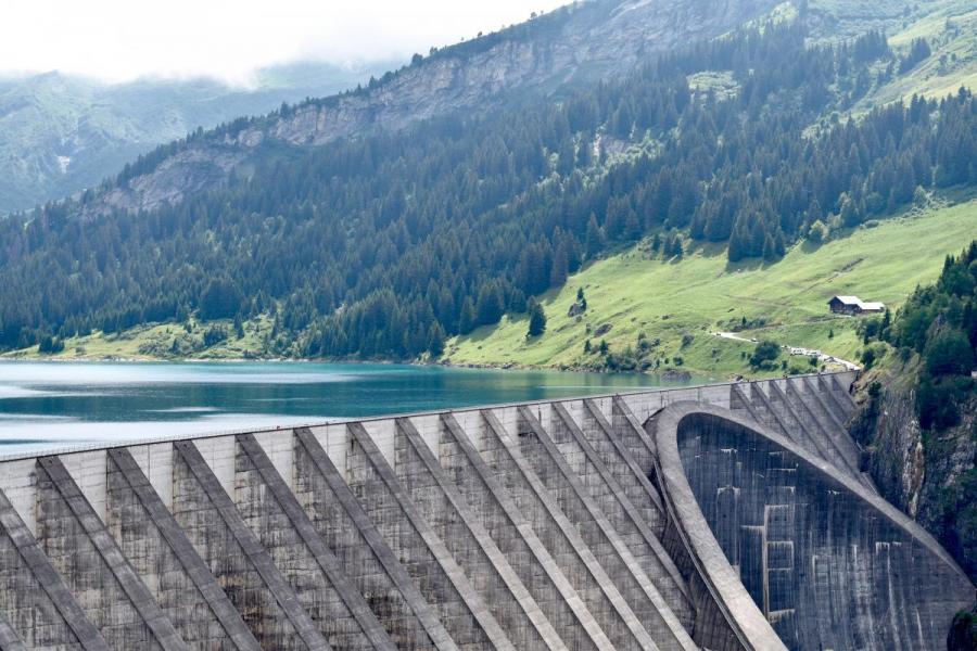 A dam next to a mountain