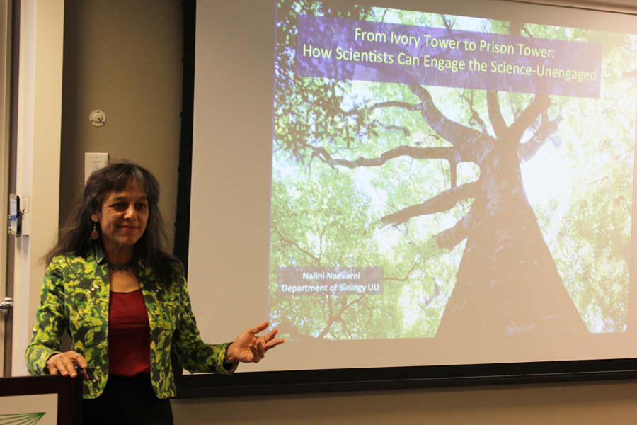 Nalini Nadkarni presenting in front of a projection screen