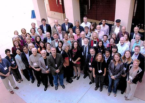 A photo of a large group of people gathered outside a building