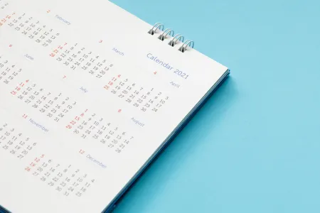 A calendar of the year 2021 on a blue background