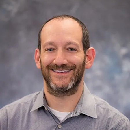 A headshot of David Kaplan