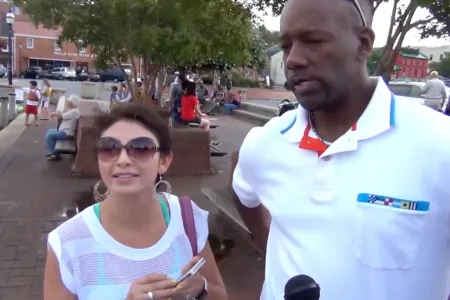 Two people being interviewed on the street
